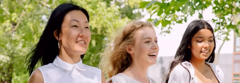 Three women walking outdoors